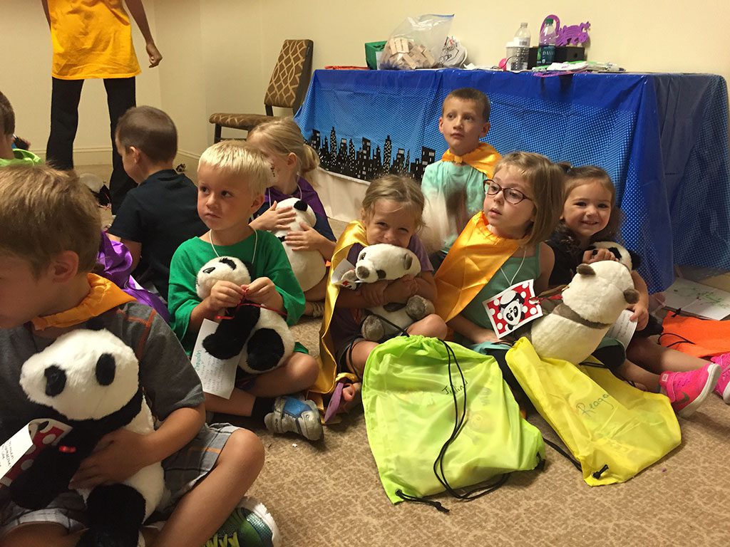 Children with stuffed Pandas